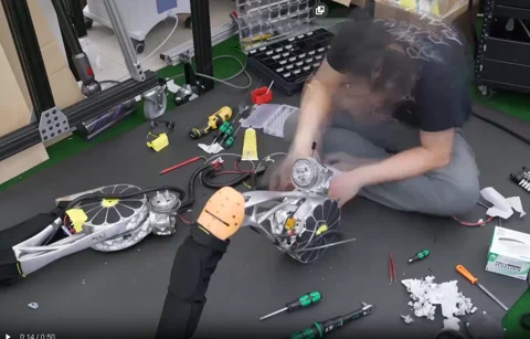 The Artemis humanoid robot standing in a lab environment.