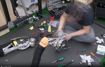 The Artemis humanoid robot standing in a lab environment.